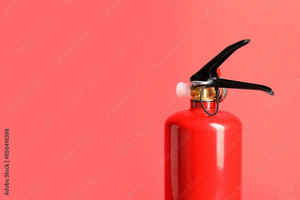 One fire extinguisher on red background, space for text One fire extinguisher on red background, space for text