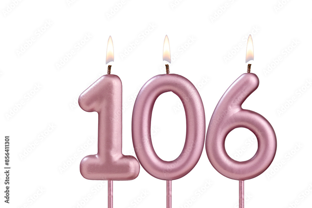 Candle number 106 - Lit birthday candle on white background Candle number 106 - Lit birthday candle on white background