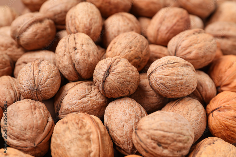 Whole walnuts as background, closeup Whole walnuts as background, closeup