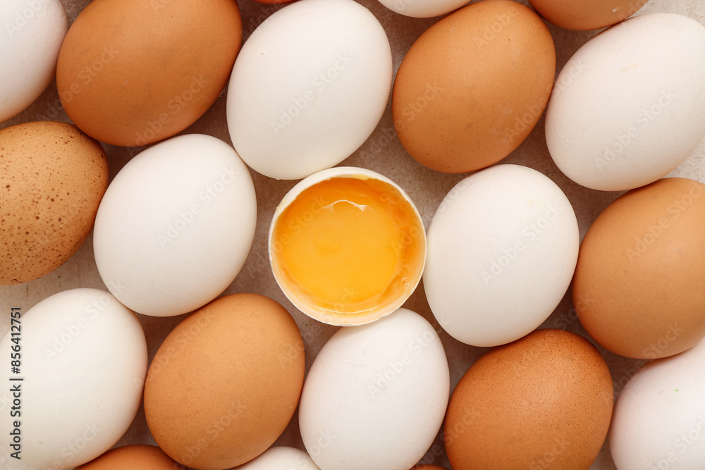 Cracked and whole chicken eggs on white background Cracked and whole chicken eggs on white background