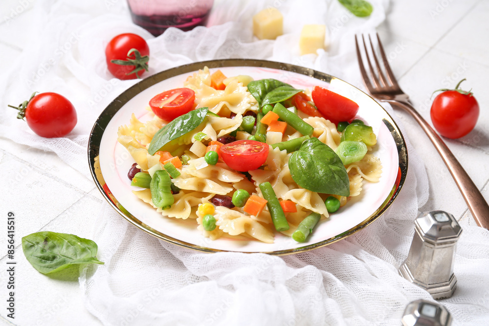 Plate with tasty pasta primavera on white background Plate with tasty pasta primavera on white background