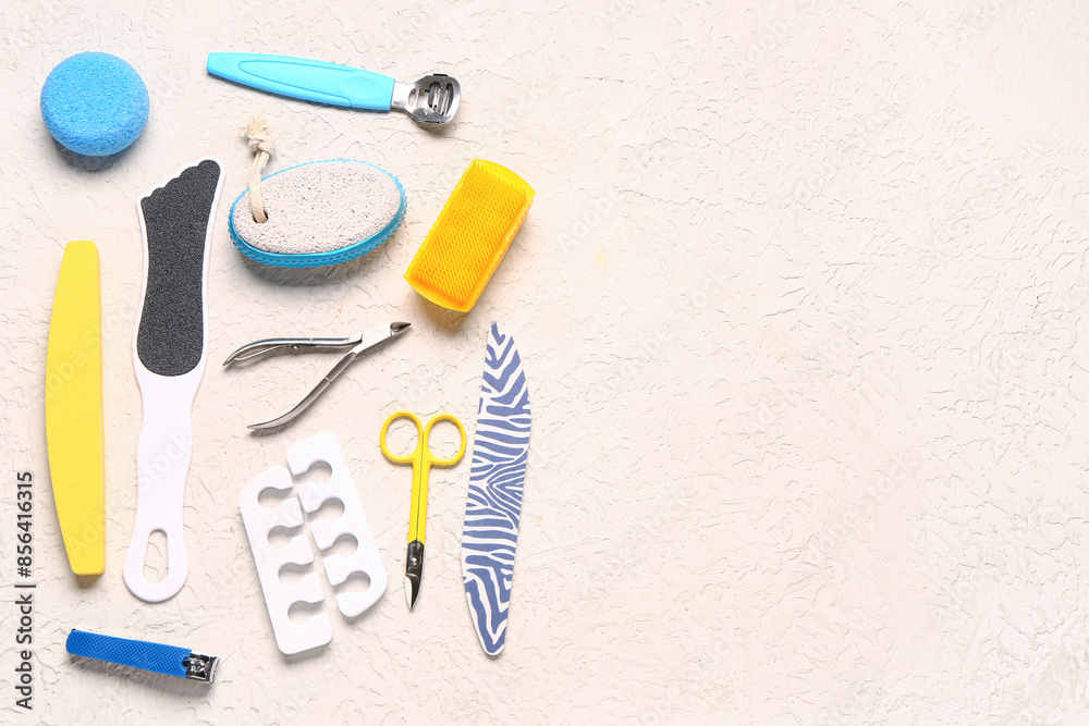 Set of professional tools for pedicure on textured white background Set of professional tools for pedicure on textured white background