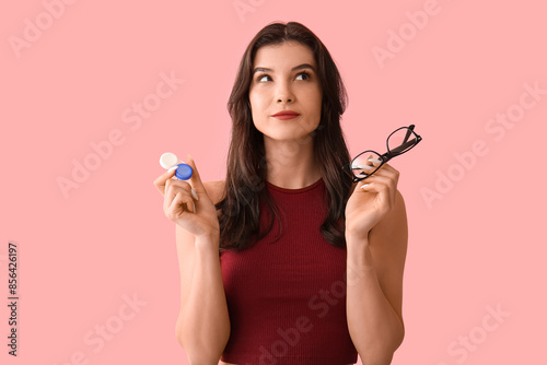 Thoughtful young woman with...