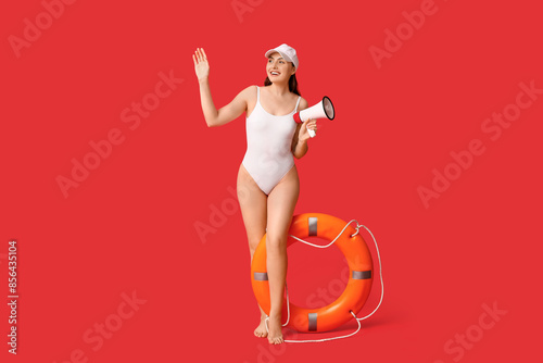 Female lifeguard with ring ...