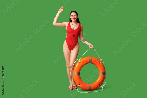 Female lifeguard with ring ...