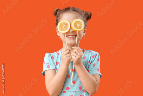 Smiling little girl holding...