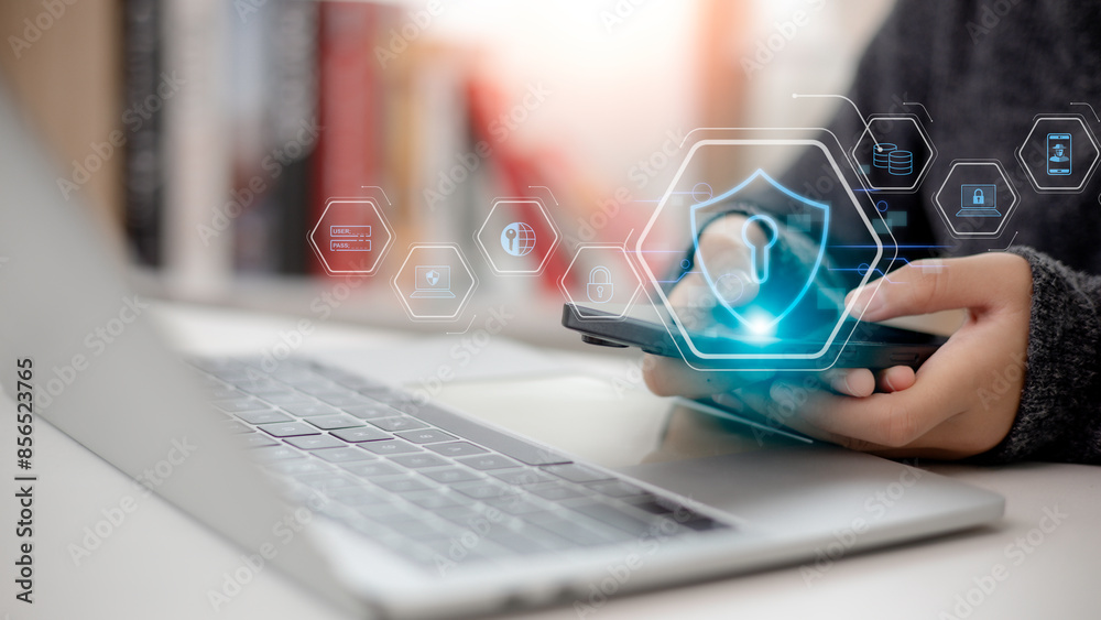 © CL STOCK - Cyber security and data protection concept. Women utilize a mobile phone with a privacy security and data encryption system for secure internet access. cybersecurity software technology. © CL STOCK - Cyber security and data protection concept. Women utilize a mobile phone with a privacy security and data encryption system for secure internet access. cybersecurity software technology.