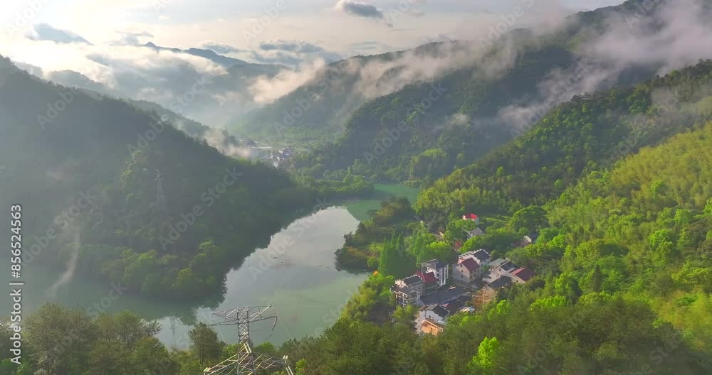 Aerial photo of Tonglu Mountain Village in Hangzhou, Zhejiang, China, surrounded by clouds and mist in the early morning