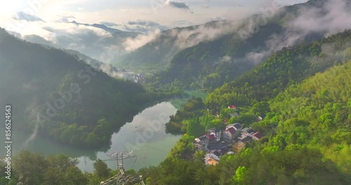 Aerial photo of Tonglu Mountain Village in Hangzhou, Zhejiang, China, surrounded by clouds and mist in the early morning photo