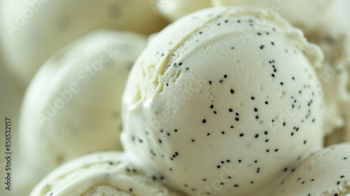 Chic coconut and black sesame gelato, a closeup of chic coconut and black sesame gelato, its creamy white texture with black specks against a white background