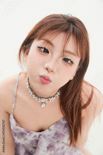 Cute Asian teenage girl on white background