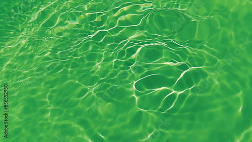 Blue water with ripples on the surface. Defocus blurred transparent blue colored clear calm water surface texture with splashes and bubbles. Water waves with shining pattern texture background.