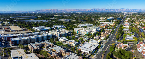 Aerial panoramic view of Main Street Cupertino residential and commercial neighborhood in San Francisco Bay Area, California. Silicon Valley skyline photo