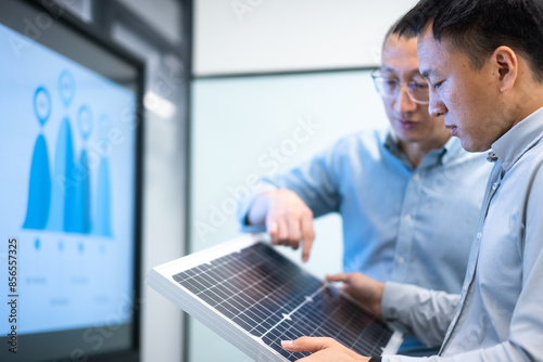 business meeting on solar panel 