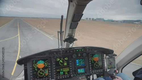 First-person view from inside the cockpit of the Bell 249 helicopter as it takes off from the runway at the Vaclav Havel Airport in Prague. photo