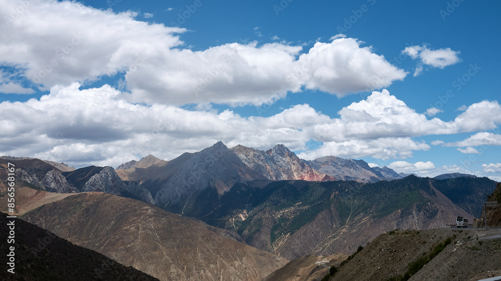 high altitude rock mountains in a sunny day with cloud in eastern tibet high altitude rock mountains in a sunny day with cloud in eastern tibet