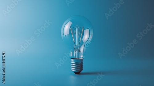 Illuminating Simplicity - Light Bulb with Filament Design on Pastel Blue Background