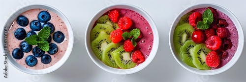 Assorted Nutritious Smoothie Bowls with Fresh Fruits Berries and Herbs on a Minimalist White Background