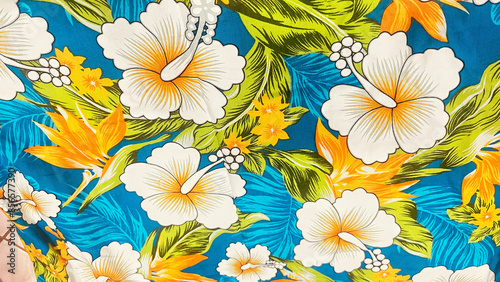 A seamless floral pattern featuring vibrant flowers and nature elements in a colorful design