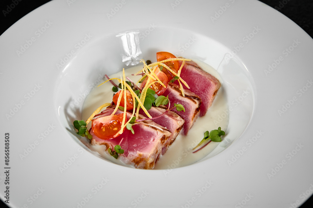 Elegant Tuna Tataki Dish Garnished with Microgreens and Cherry Tomatoes on White Plate Elegant Tuna Tataki Dish Garnished with Microgreens and Cherry Tomatoes on White Plate