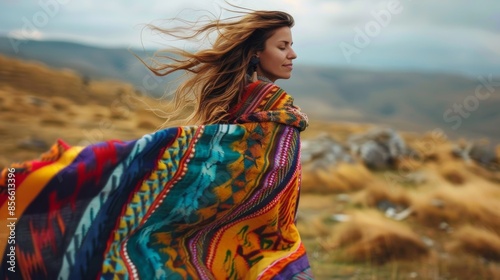 A freespirited individual with a colorful poncho flowing behind them in the blustery breeze.