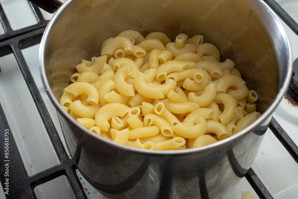 A view of drained macaroni pasta in a stockpot. A view of drained macaroni pasta in a stockpot.