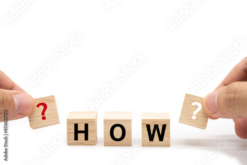 Hand place HOW wooden blocks of business concept isolated on white background. Copy space.