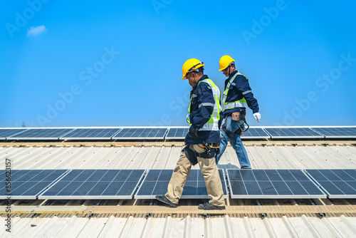 Wallpaper Mural Worker Technicians are working to construct solar panels system on roof with sky and clound on background. Installing solar photovoltaic panel system. Renewable clean energy technology concept. Torontodigital.ca