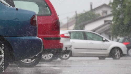 Raining, raindrops hit table, car parks in the rain, slow motion from 200fps footage