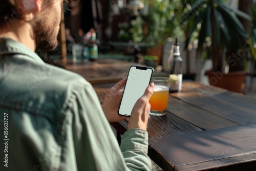 mockup smartphone in man hand showing white screen photo