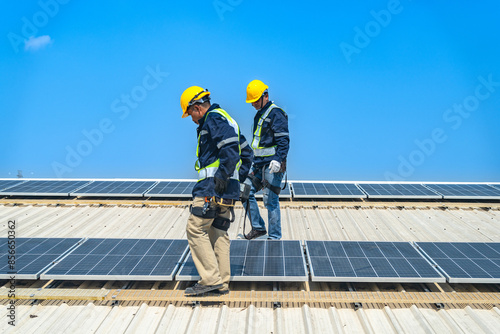 Wallpaper Mural Worker Technicians are working to construct solar panels system on roof with sky and clound on background. Installing solar photovoltaic panel system. Renewable clean energy technology concept. Torontodigital.ca