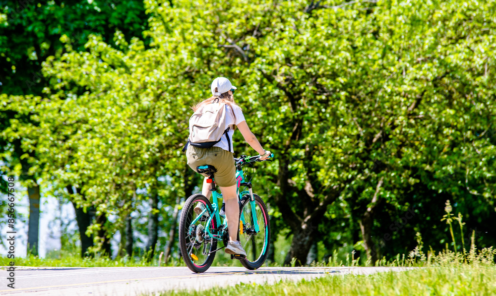 Cyclist ride on the bike path in the city Park
Cyclist ride on the bike path in the city Park