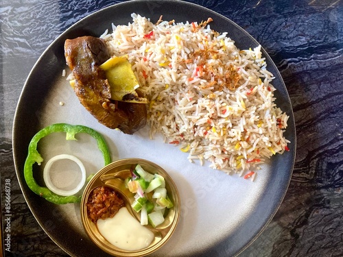 A plate of biryani or mandhi rice with lamb photo