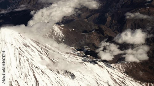 Aerial view from airplane of snow covered Iran mountain landscape in middle east. photo