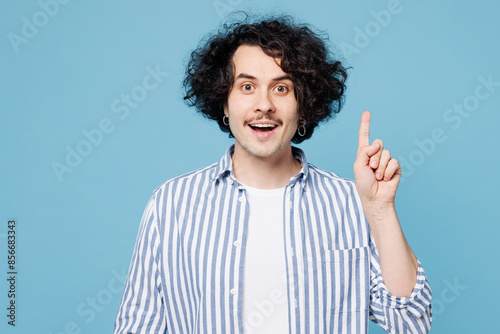Young insighted fun smart proactive man he wear shirt white t-shirt casual clothes holding index finger up with great new idea isolated on plain pastel light blue cyan background. Lifestyle concept