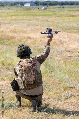 Konstfotografi Soldiers launching a combat drone into flight