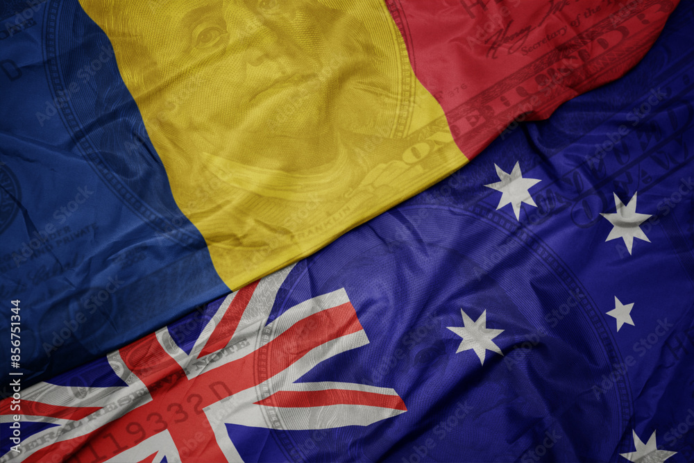 waving colorful flag of romania and national flag of australia on the dollar money background. finance concept. waving colorful flag of romania and national flag of australia on the dollar money background. finance concept.