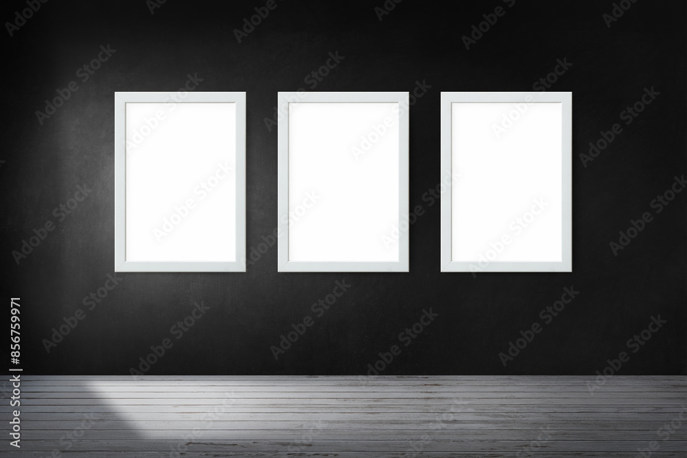 White picture frame mockups hanging on a black wall White picture frame mockups hanging on a black wall