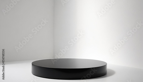A black circular platform, empty black pedestal on a studio background for product mock-up, presentation, modern design, 3d rendering