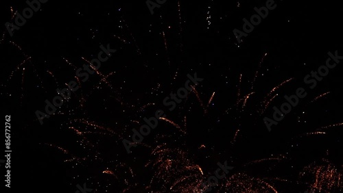 Festive fireworks in night sky of big city.