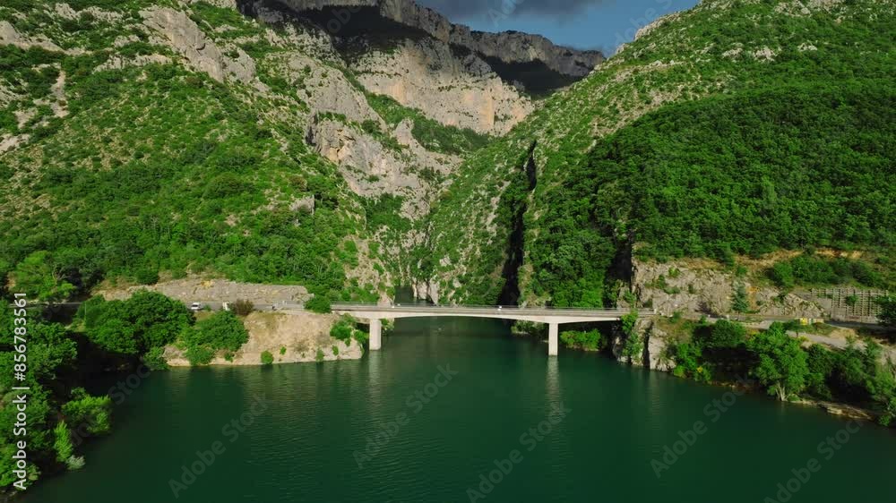 Drone shot of Galetas Bridge crossing the Lake of Sainte-Croix on a sunny day in Aiguines, France Drone shot of Galetas Bridge crossing the Lake of Sainte-Croix on a sunny day in Aiguines, France