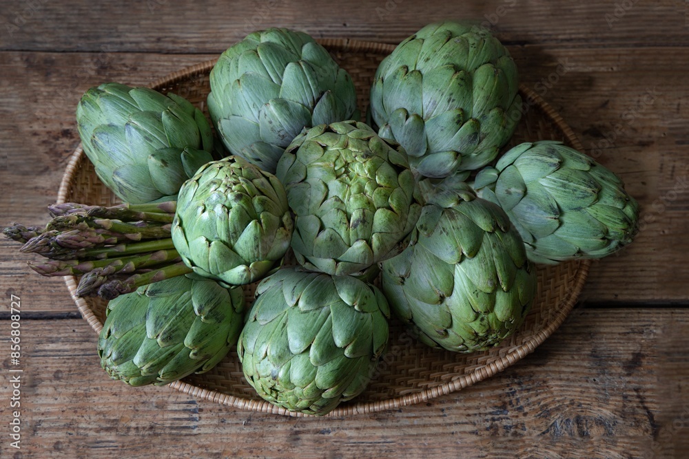 Artichokes and asparagus on a market stall Artichokes and asparagus on a market stall