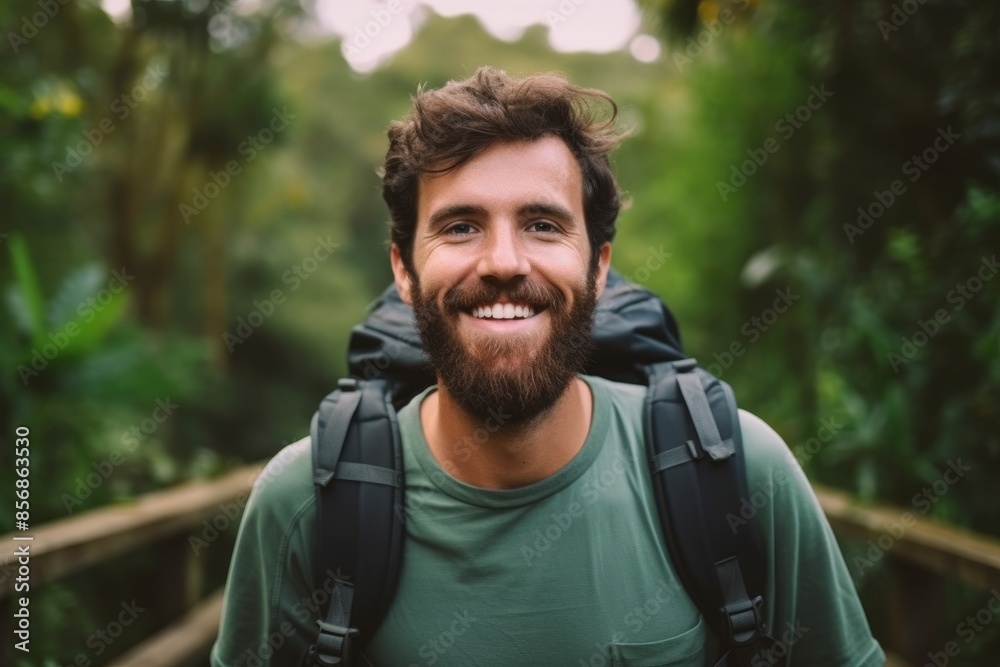 portrait of happy face of a man in a forest in nature with trees trekking on jungle freedom adventure in summer. hiking male enjoy outdoor with a smile while walking, explore and hike on a adventure portrait of happy face of a man in a forest in nature with trees trekking on jungle freedom adventure in summer. hiking male enjoy outdoor with a smile while walking, explore and hike on a adventure