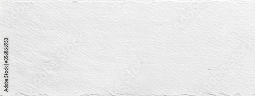 A close up of a torn piece of paper on a plain white background photo