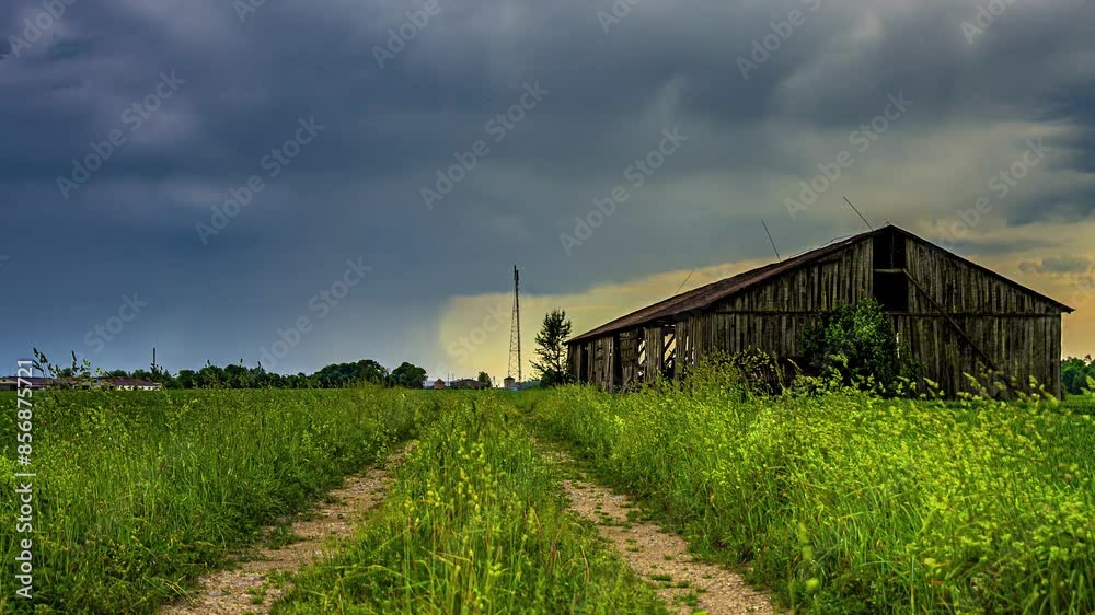 Weathered Wooden Barn House Isolated On Rural Landscape. Timelapse Weathered Wooden Barn House Isolated On Rural Landscape. Timelapse