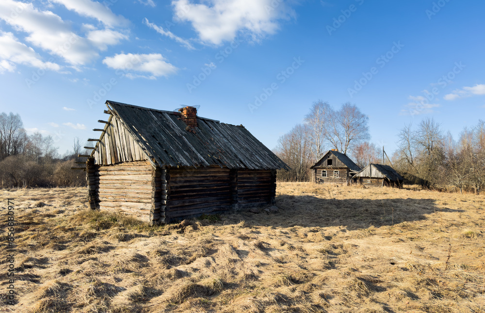 Abandoned house in village. Old wooden house in countryside in spring. No people in village. Old House in rural. Abandoned village with destroyed houses. Wooden Home ruin in countryside Abandoned house in village. Old wooden house in countryside in spring. No people in village. Old House in rural. Abandoned village with destroyed houses. Wooden Home ruin in countryside