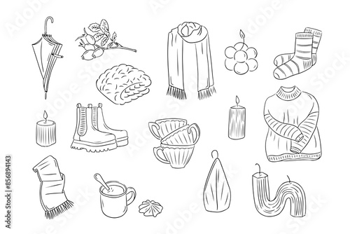 Warm autumn clothes and cozy home items in outline doodle style. Monochrome hygge contour stickers . Vector clipart of sketchy drawings isolated on white background. Could be used for coloring pages