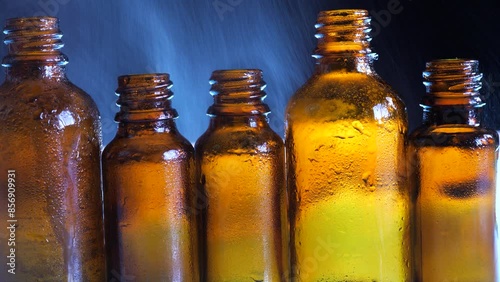 Drops of water sprayed on medicine bottles 
