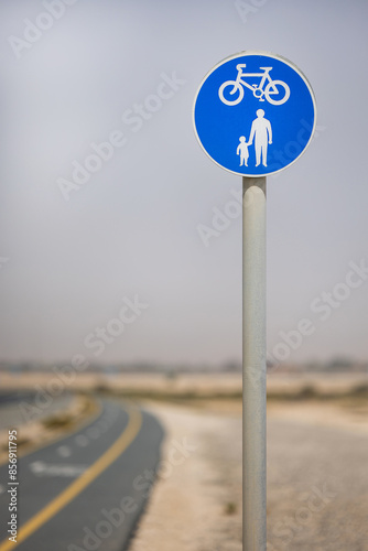 cycling and walking sign on the road