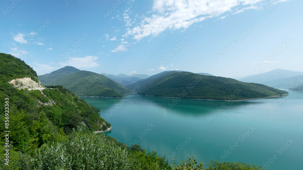 beautiful landscape with a small mountain and a bright green lake beautiful landscape with a small mountain and a bright green lake